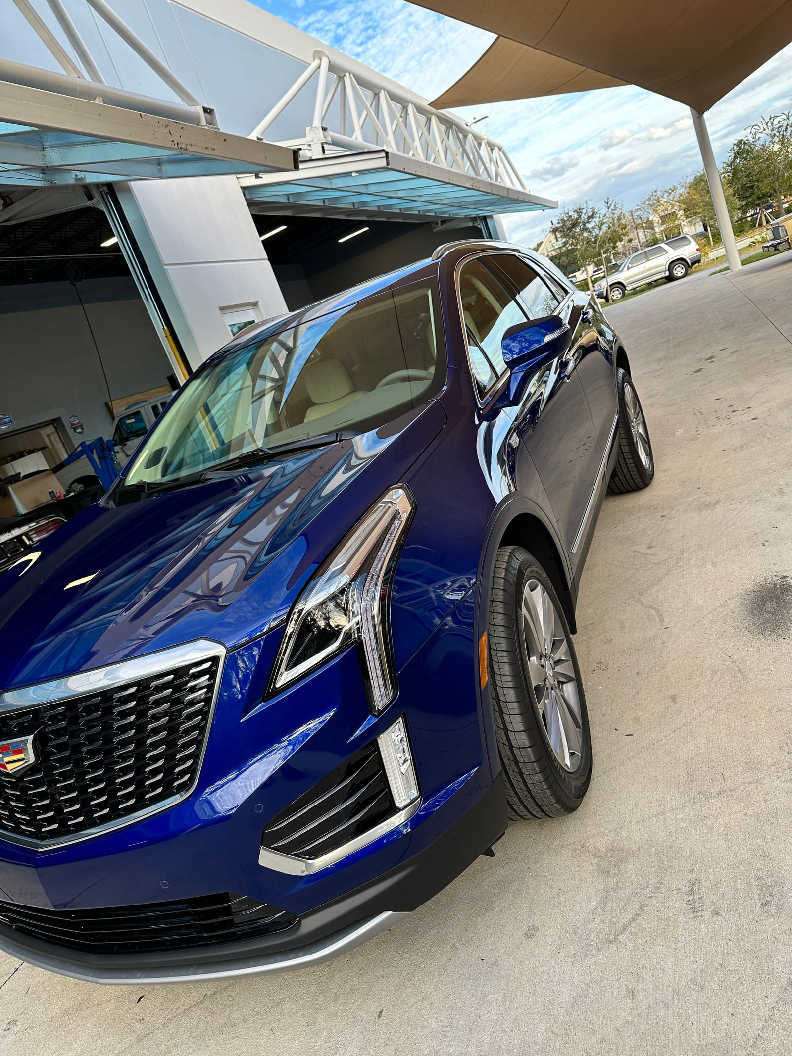 Blue Cadillac XT5 after a full interior and exterior detail