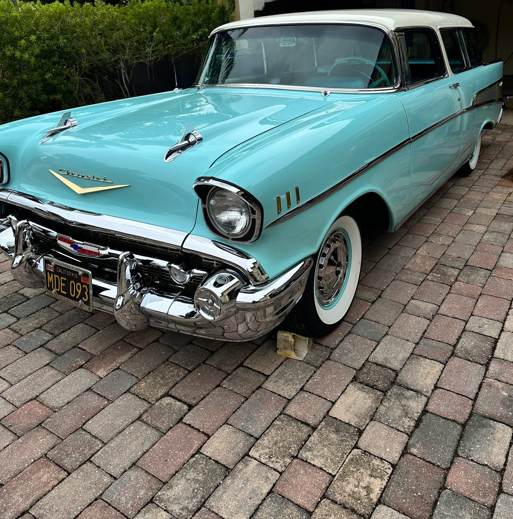 Turquoise 1957 Chevrolet Nomad with polished chrome and restored paint